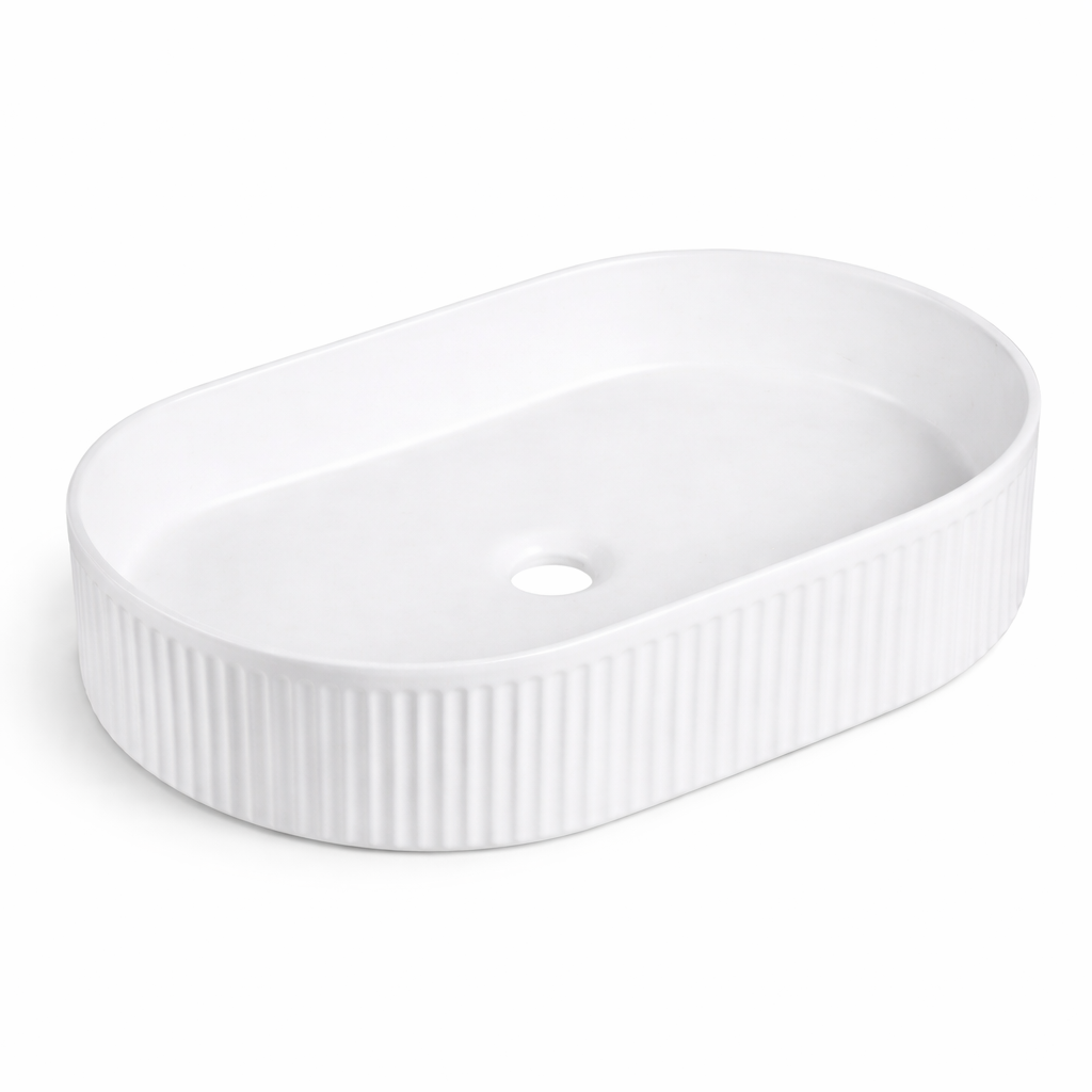 Modern matte white oval vessel bathroom sink with a fluted, ribbed exterior design.