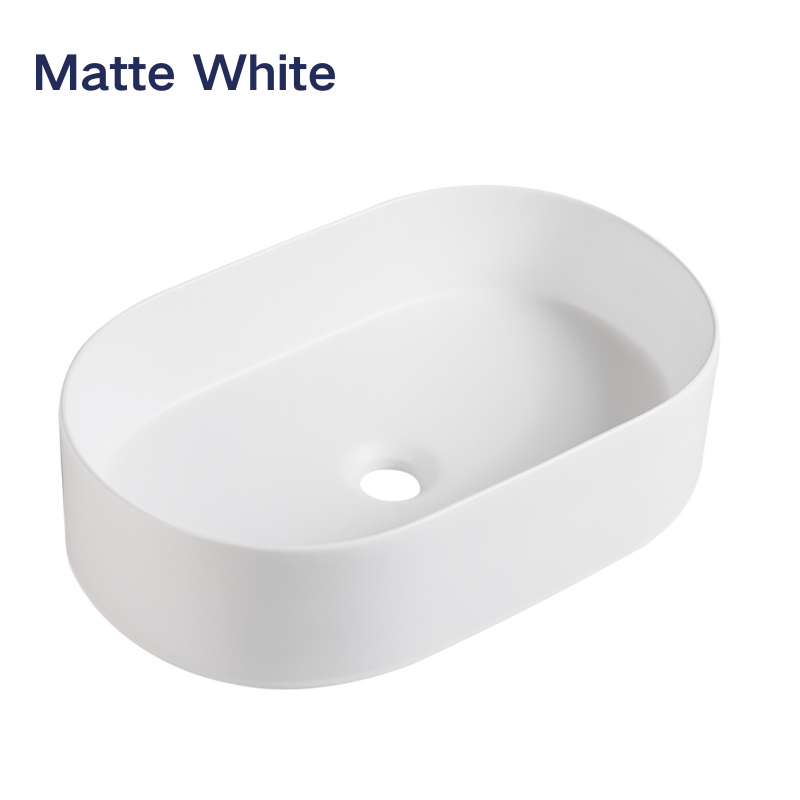 Matte white oval vessel sink for modern bathroom countertop vanity.