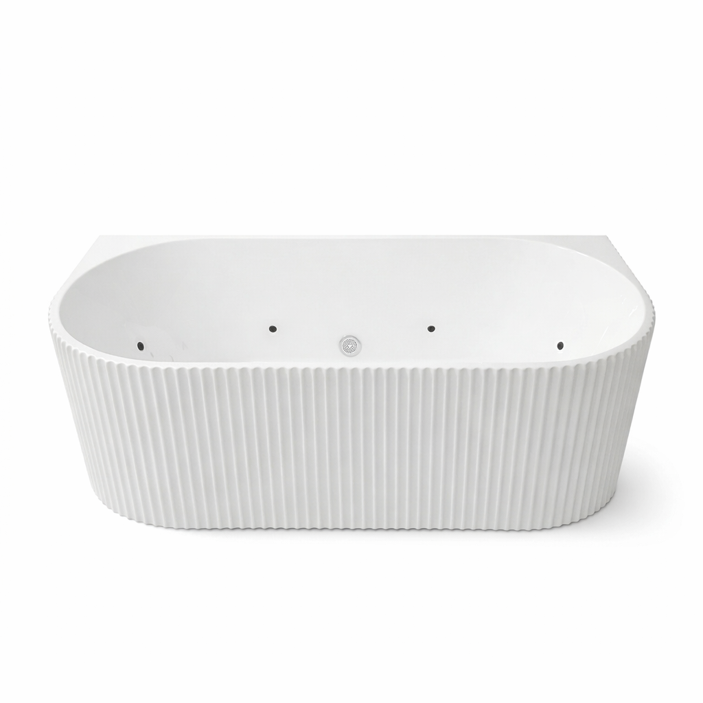 Modern white fluted back-to-wall whirlpool bathtub with an oval interior and ribbed exterior design.