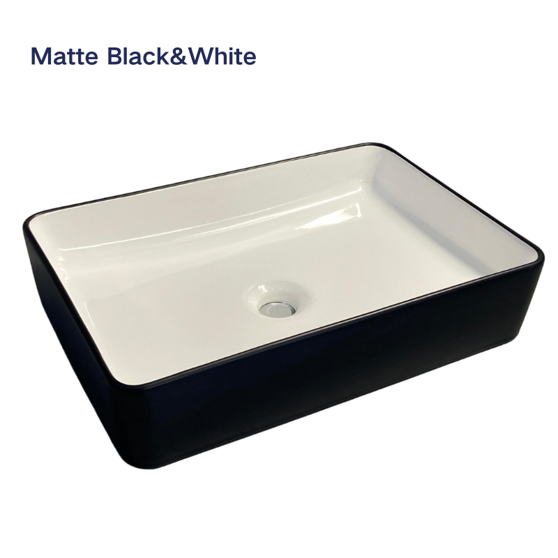Rectangular matte black and white ceramic vessel sink for bathroom countertop.