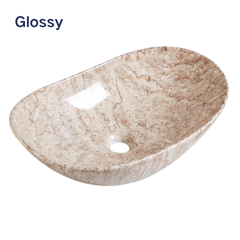 Glossy oval vessel bathroom sink with beige and brown marble pattern.
