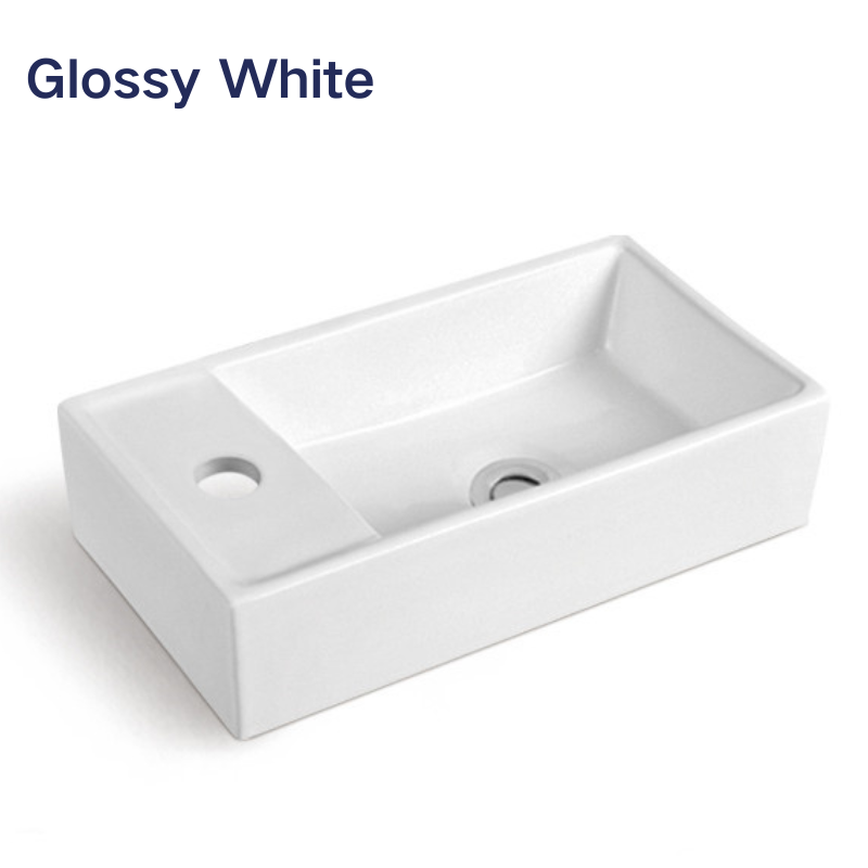 Modern glossy white rectangular ceramic bathroom sink with single faucet hole.