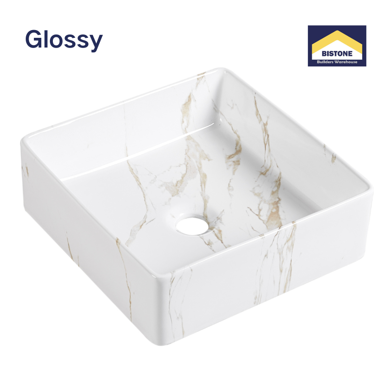 Glossy white square ceramic vessel sink with gold marble veining for modern bathroom vanities.