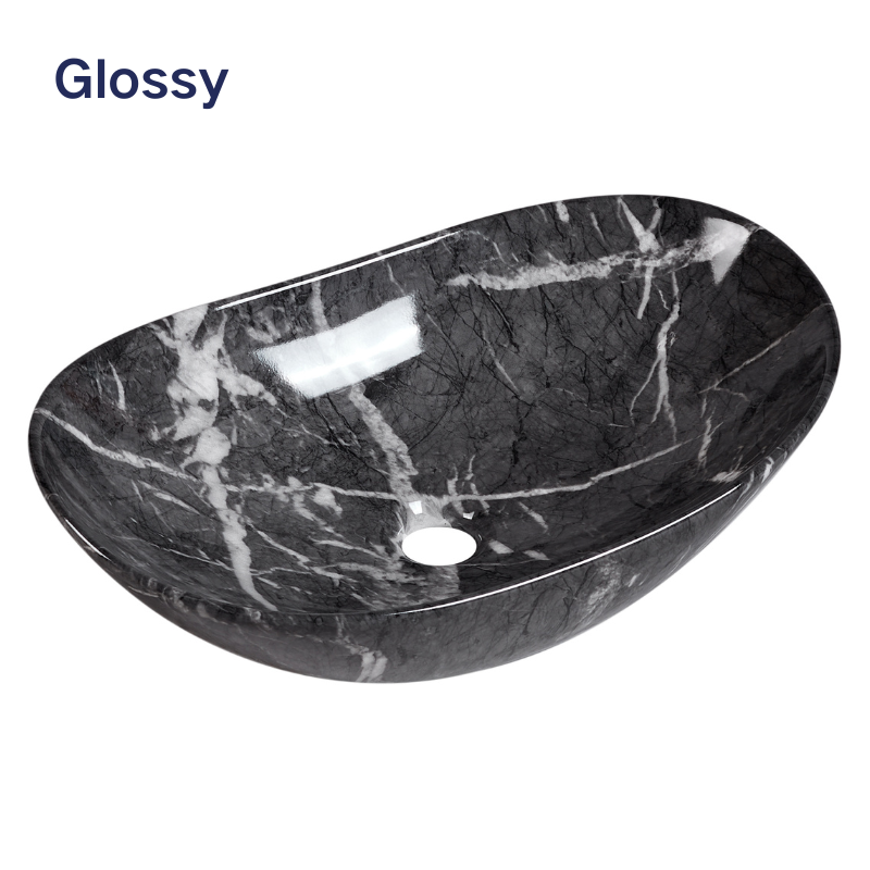 Glossy black marble effect oval vessel sink with white veining for modern bathroom vanity.