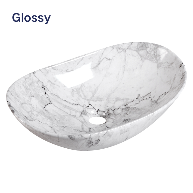 Glossy white marble oval vessel sink with grey veining for modern bathroom vanity.