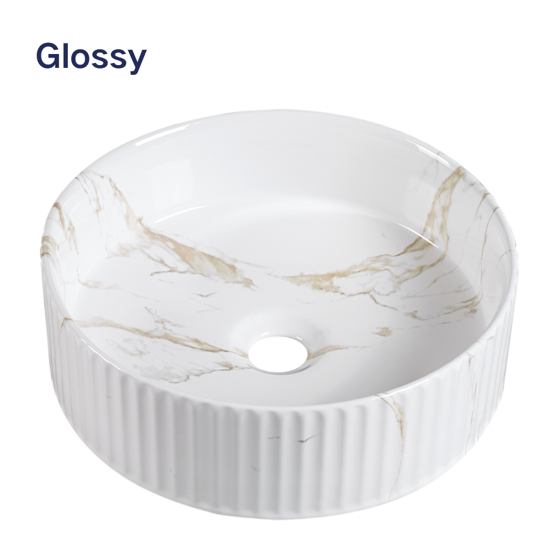 Glossy white marble vessel sink with gold veining, fluted ceramic round bathroom basin for vanity countertop.