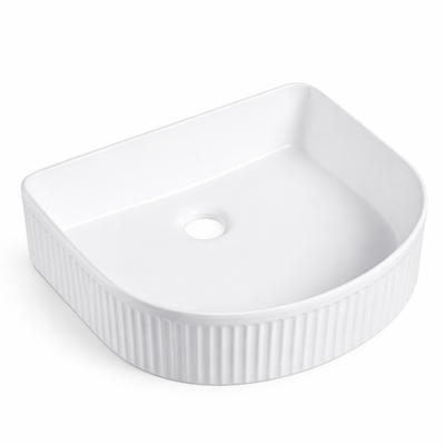 White fluted ceramic vessel sink, D-shaped bathroom basin with ribbed exterior texture.