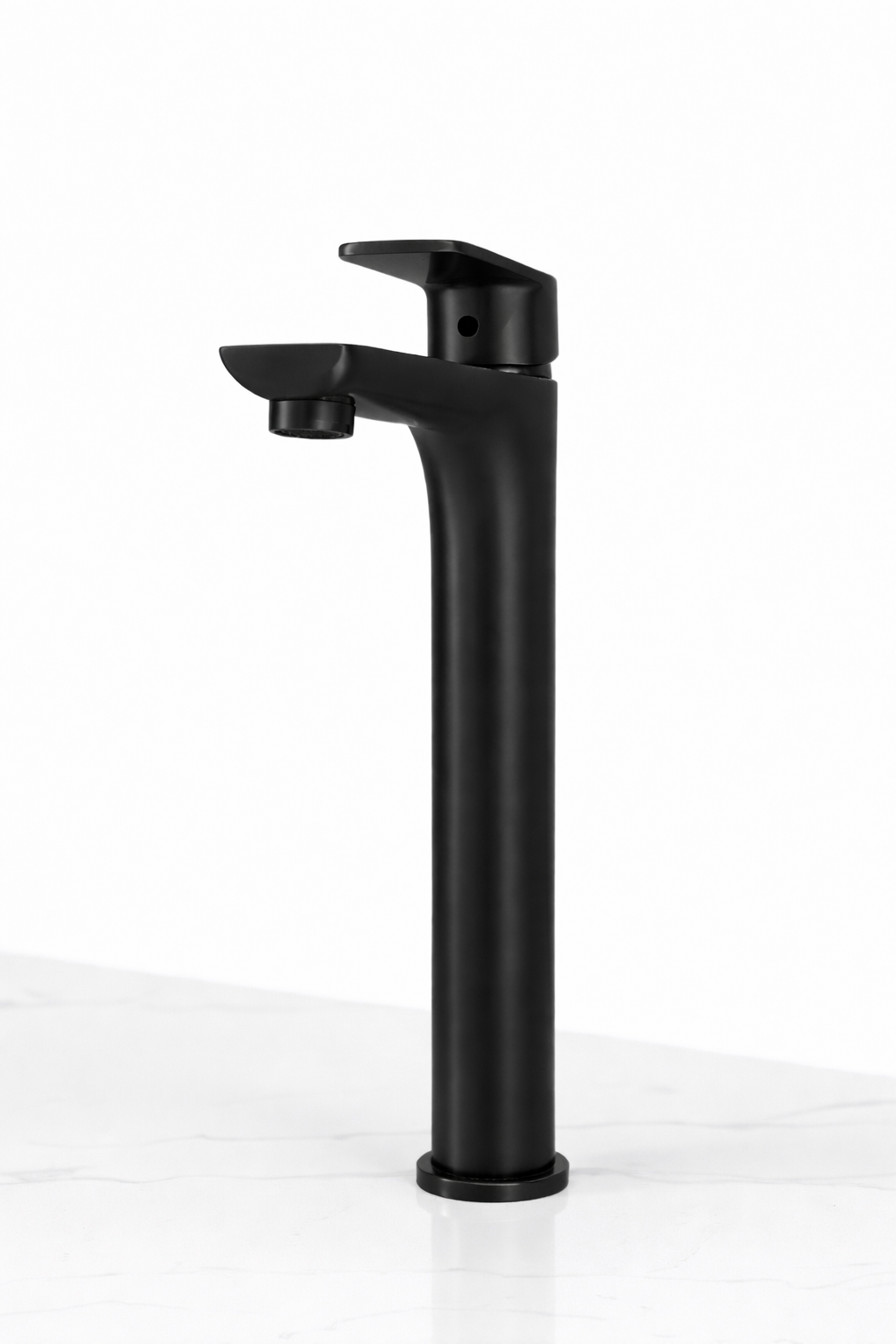 Modern matte black tall vessel bathroom faucet with single handle on white marble countertop.