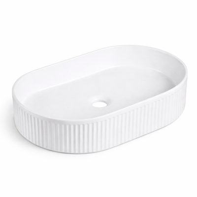 Modern matte white oval vessel bathroom sink with a fluted, ribbed exterior design.