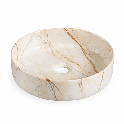 Round cream marble-effect ceramic vessel sink, modern above-counter bathroom washbasin.
