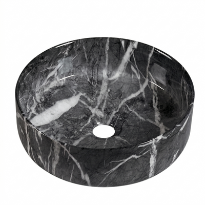 Round black marble vessel sink with white veining for modern bathroom vanity countertops.