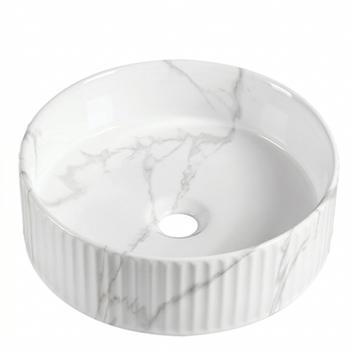 Round white marble vessel sink with fluted exterior, modern countertop basin for bathroom vanity.