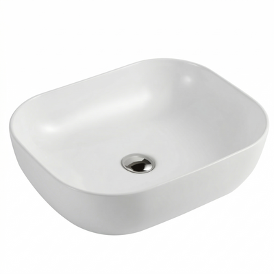 Modern white rectangular vessel bathroom sink with rounded edges and chrome pop-up drain for countertop vanity.