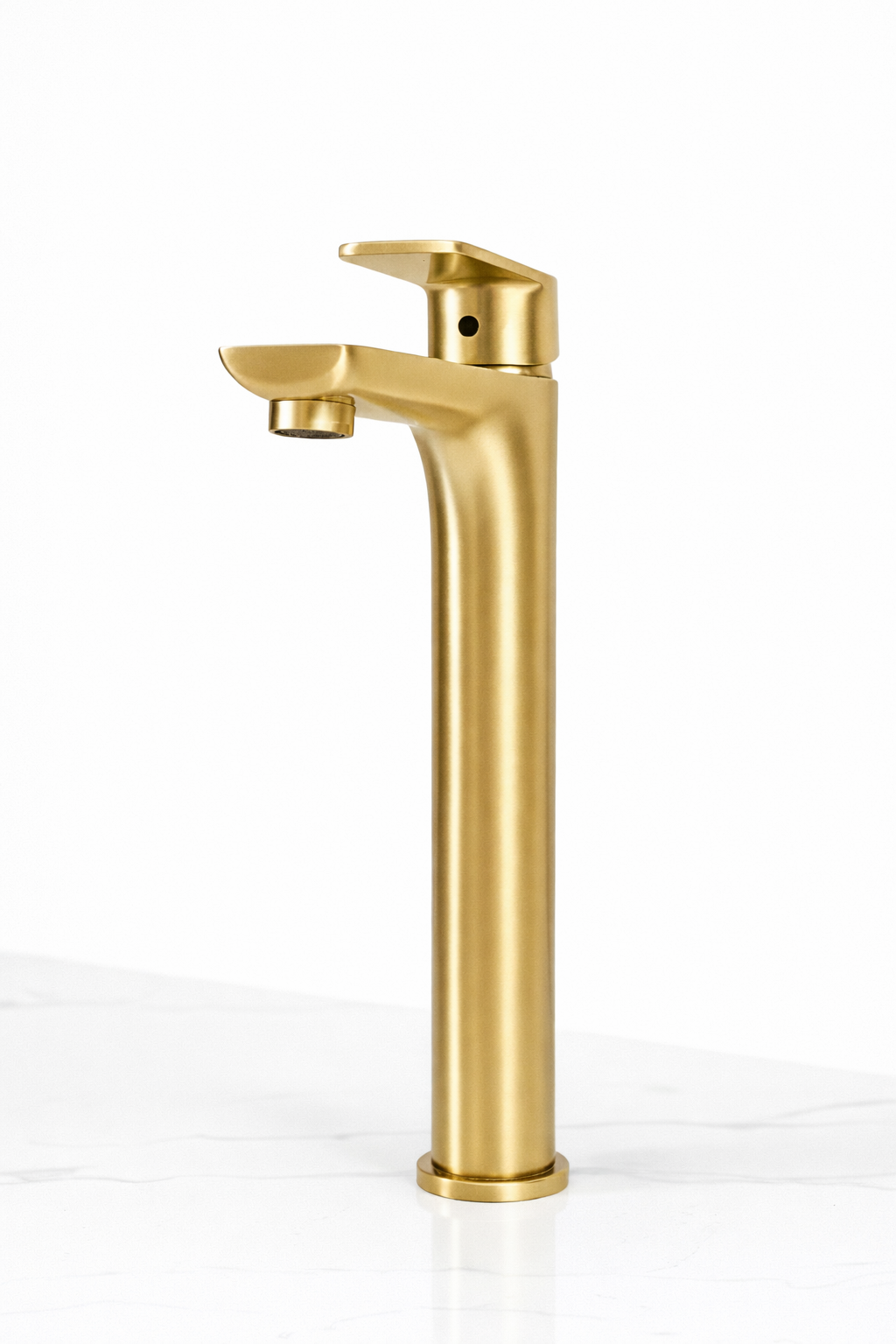 Modern brushed gold tall vessel sink bathroom faucet with single handle on white marble surface.