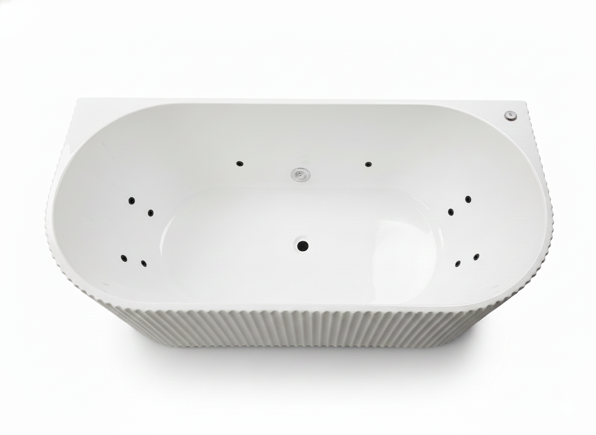 White oval whirlpool bathtub with fluted exterior and integrated massage jets for a luxury bathroom.