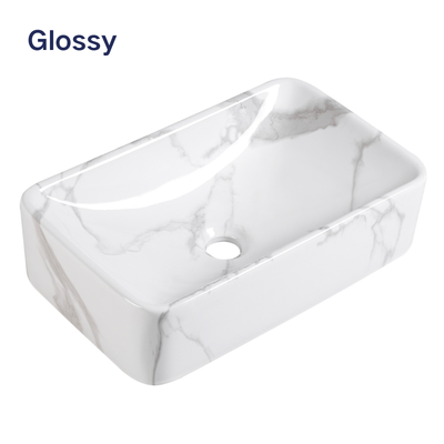 Glossy white marble rectangular ceramic vessel sink for modern bathroom vanity.
