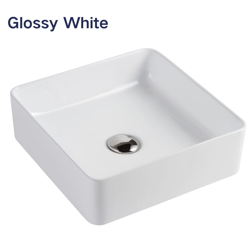 Glossy white square ceramic vessel sink for bathroom with chrome pop-up drain.