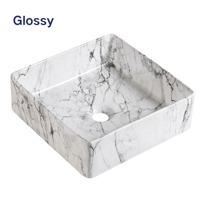 Glossy white marble square vessel sink, modern ceramic bathroom washbasin with grey veining.