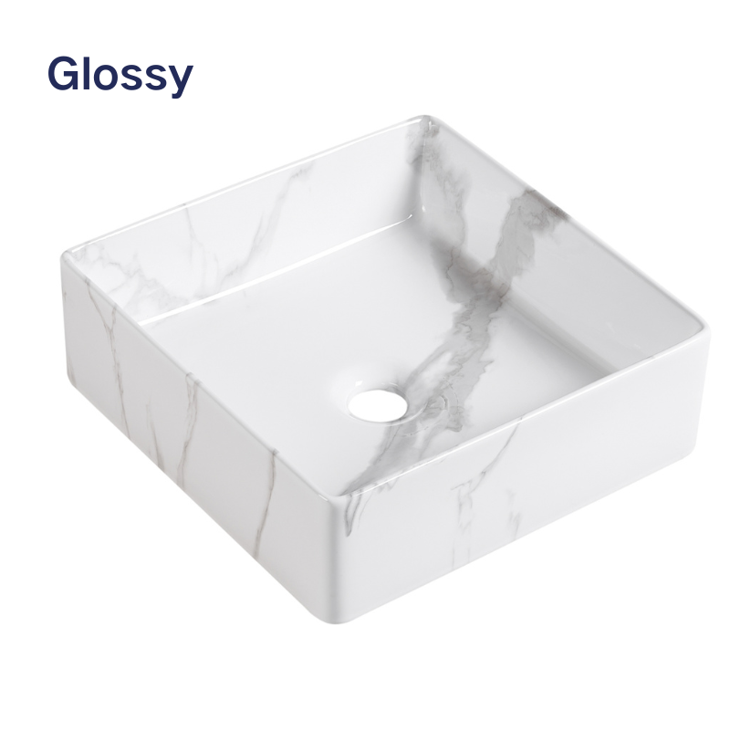 Glossy white square ceramic vessel sink with gray marble pattern for bathroom vanity.
