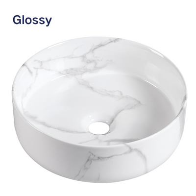 Glossy white marble round vessel sink with grey veining for modern bathroom vanity.