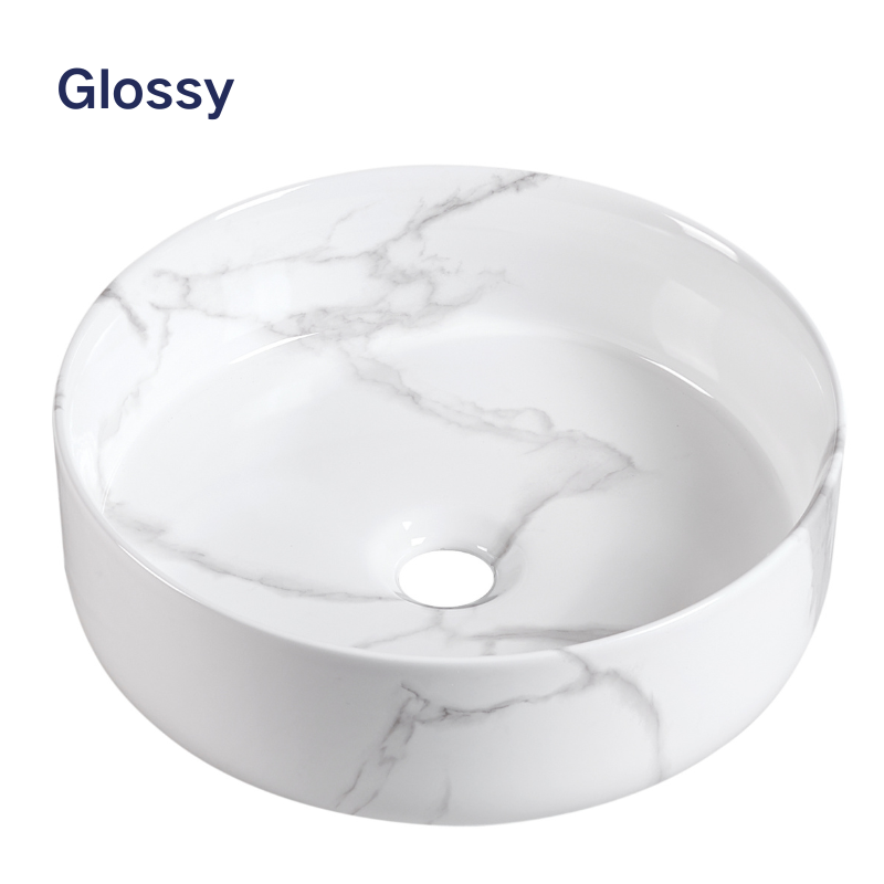 Glossy white marble round vessel sink with grey veining for modern bathroom vanity.