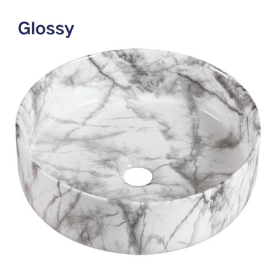 Glossy white marble pattern round ceramic bathroom vessel sink.