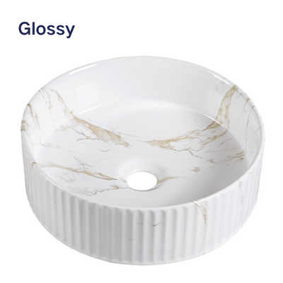 Glossy white marble vessel sink with gold veining, fluted ceramic round bathroom basin for vanity countertop.