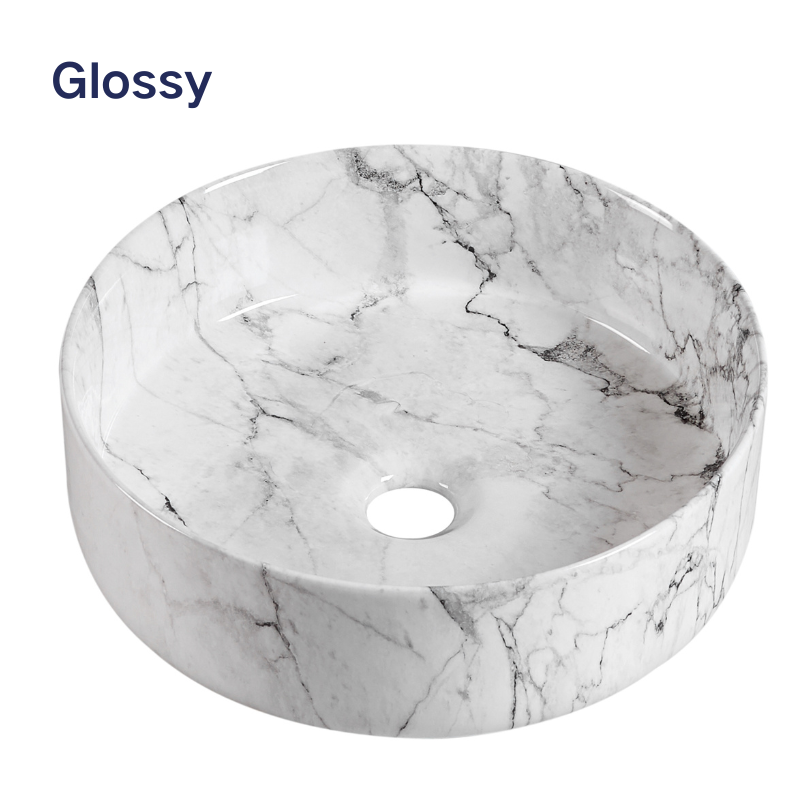 Glossy white marble pattern round vessel bathroom sink with gray veining.