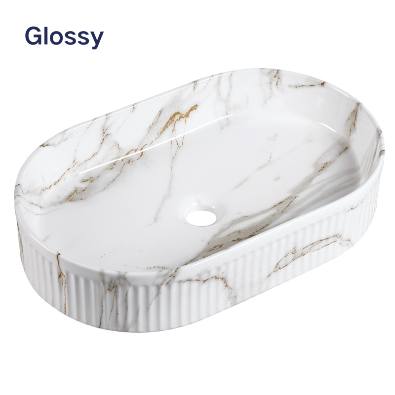 Glossy white marble-effect oval vessel sink with gold veining and a fluted exterior for bathroom vanities.
