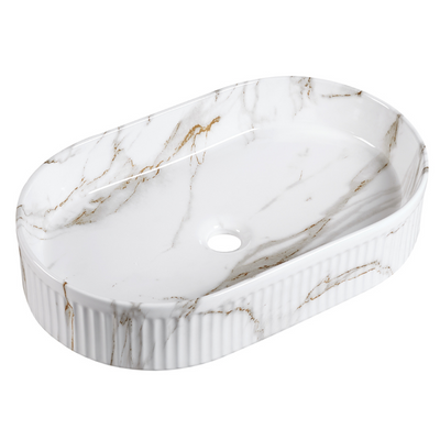 Glossy white marble oval vessel sink with fluted exterior for bathroom countertop vanity.