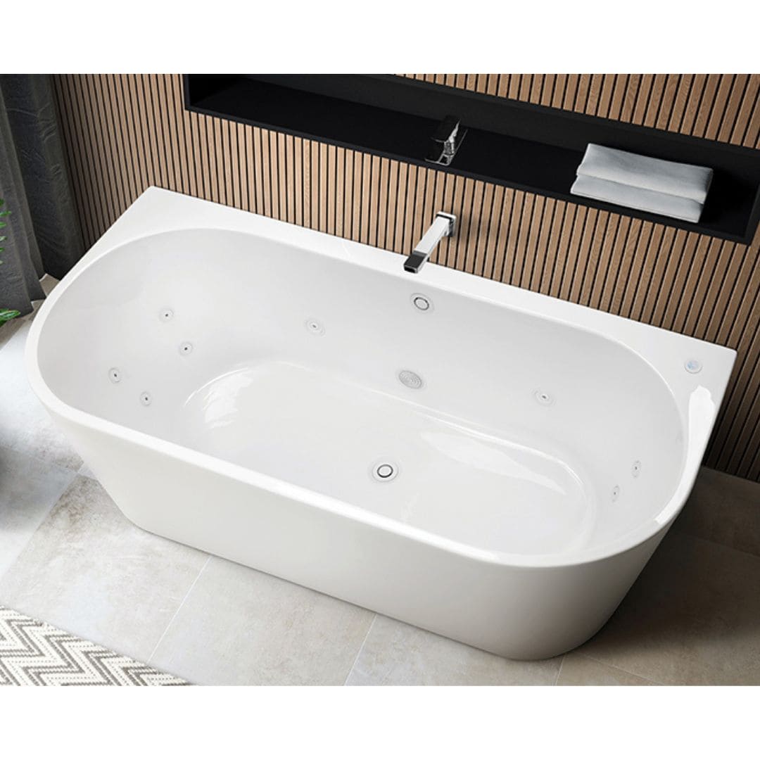 White jetted whirlpool bathtub with chrome faucet in a modern bathroom with wood-slat wall accents.