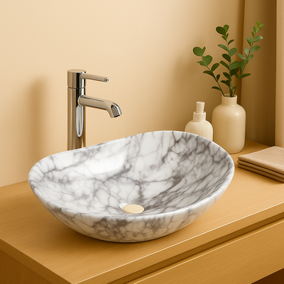 Oval white marble vessel sink with grey veining and chrome faucet on a modern wooden vanity.